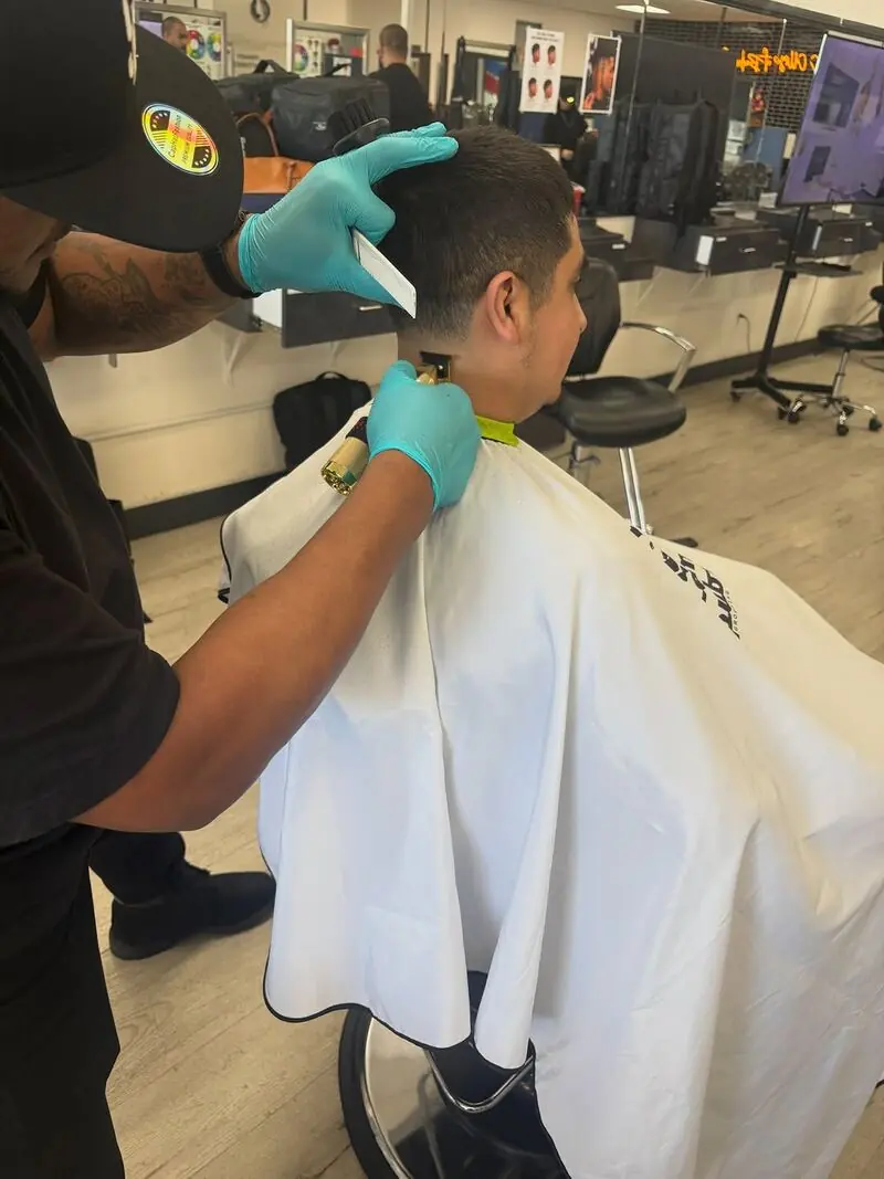 Barber student practicing a cut at SCCBB